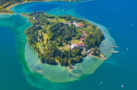 Aerial view of Mainau Island on Lake Constance, surrounded by water and nature.