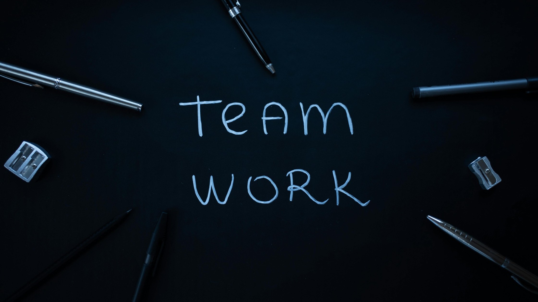 “Teamwork” written on a chalkboard