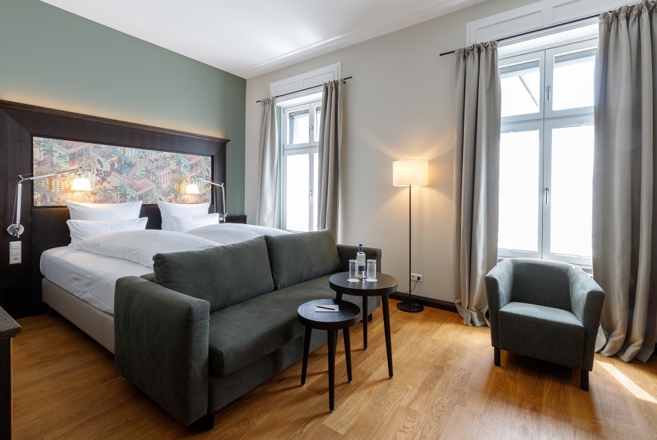 A stylishly furnished deluxe double room at Hotel Alte Post Konstanz. 