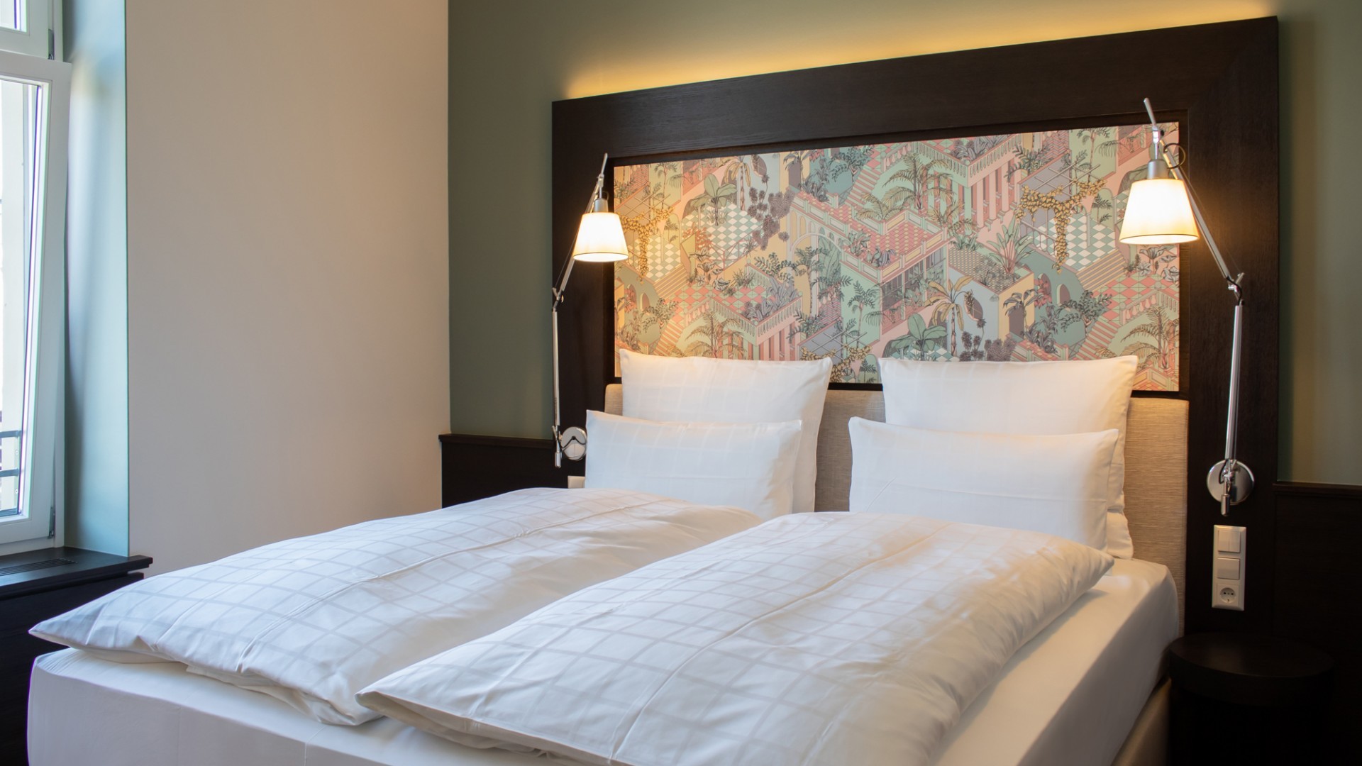 Elegant double bed with premium linens in a stylishly decorated room at Hotel Alte Post